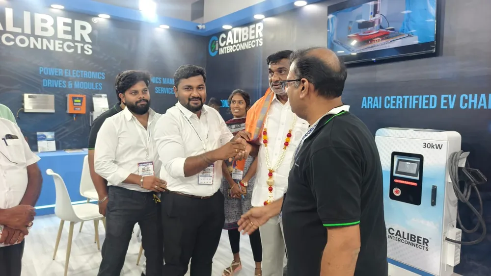 Exhibitors speaking with visitors at the power solutions stand