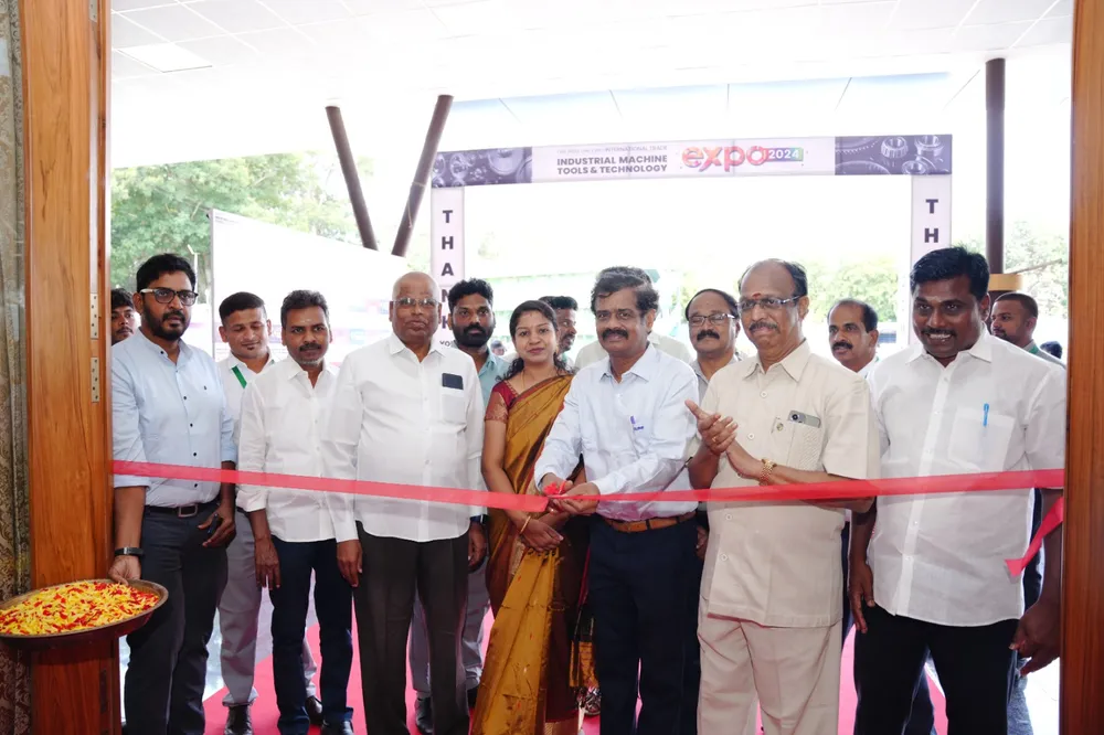 Guests cutting the ribbon at the exhibition entrance